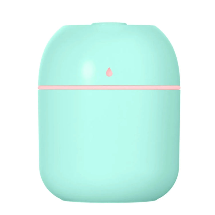 Teal compact USB humidifier with pink accent band and mist outlet on top