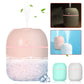 Pink USB humidifier with water splash effect, showing compact cube-like design