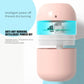 Pink USB humidifier with open internal mist unit and glowing water-drop indicator