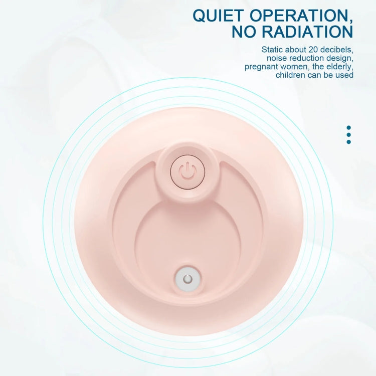 Pink humidifier base with circular power button and internal mist plate