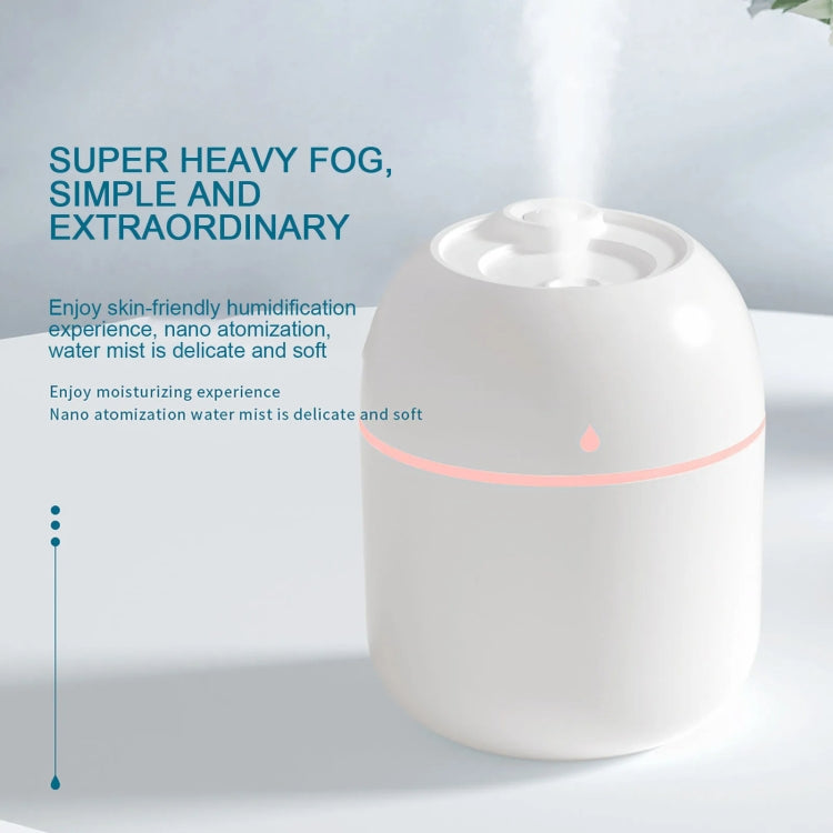 White compact USB humidifier with central mist outlet and pink accent band
