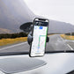 Black suction-cup car phone mount holding a smartphone with navigation screen
