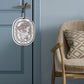 Hanging car fragrance tablet card with circular lavender-toned illustration.