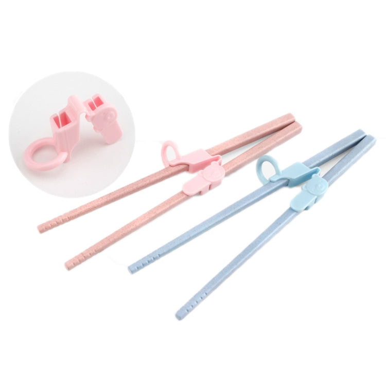Children’s chopstick practice grips with pink and blue finger cots on chopsticks