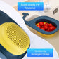 Blue whale-shaped draining basket with perforated yellow insert and food inside