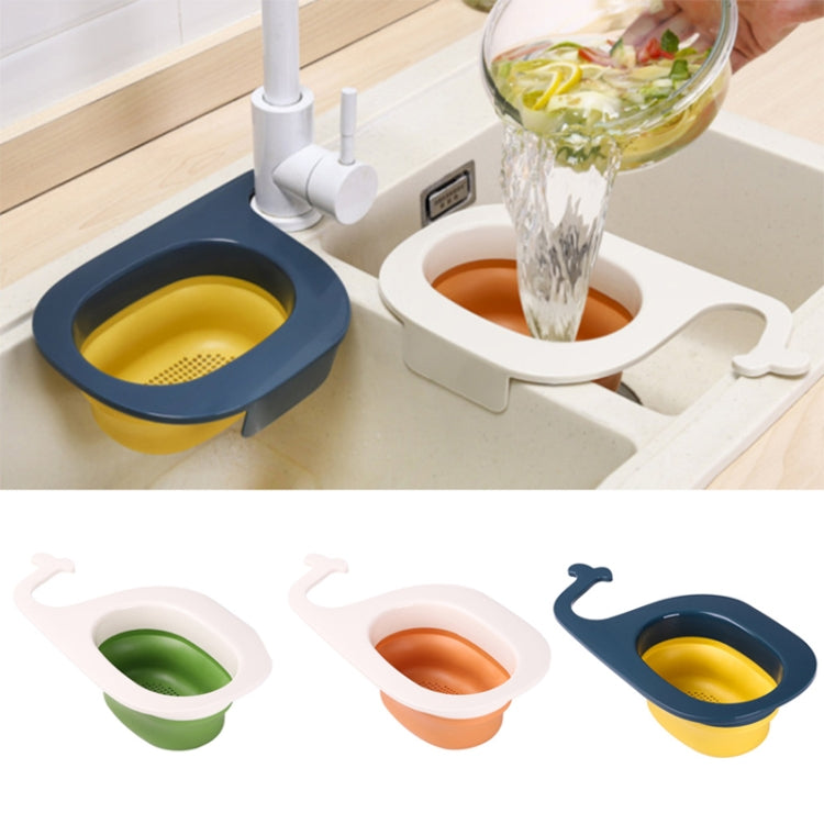 Blue whale-shaped foldable draining basket beside sink faucet with yellow perforated insert