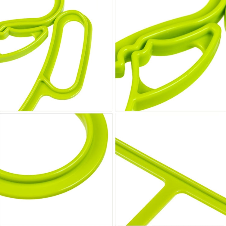Green quilt clip close-up with curved anti-skid gripping pads