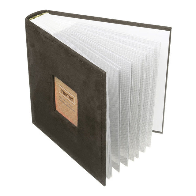 Dark green velvet photo album insert book, page edges stacked along the side