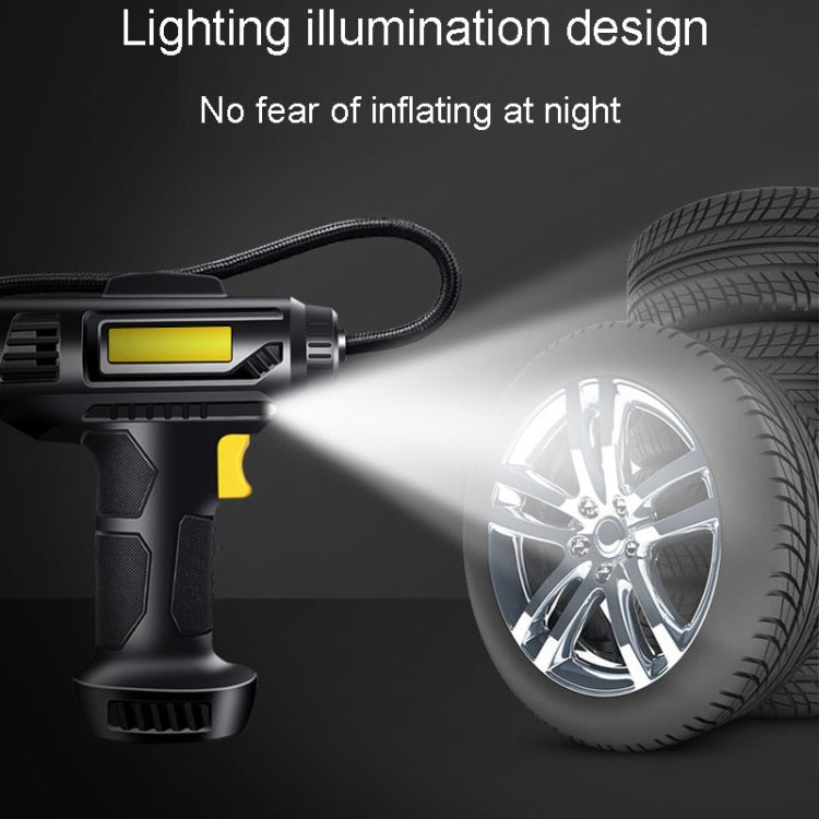 Portable car tire inflator with LED light illumination beam near a wheel