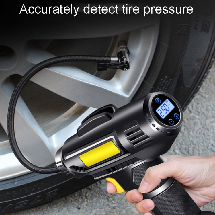 Portable tire inflator with digital gauge display attached to a car wheel valve