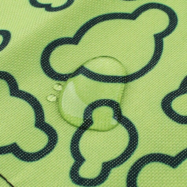Close-up of green cloud fabric surface with dark outlined clover shapes