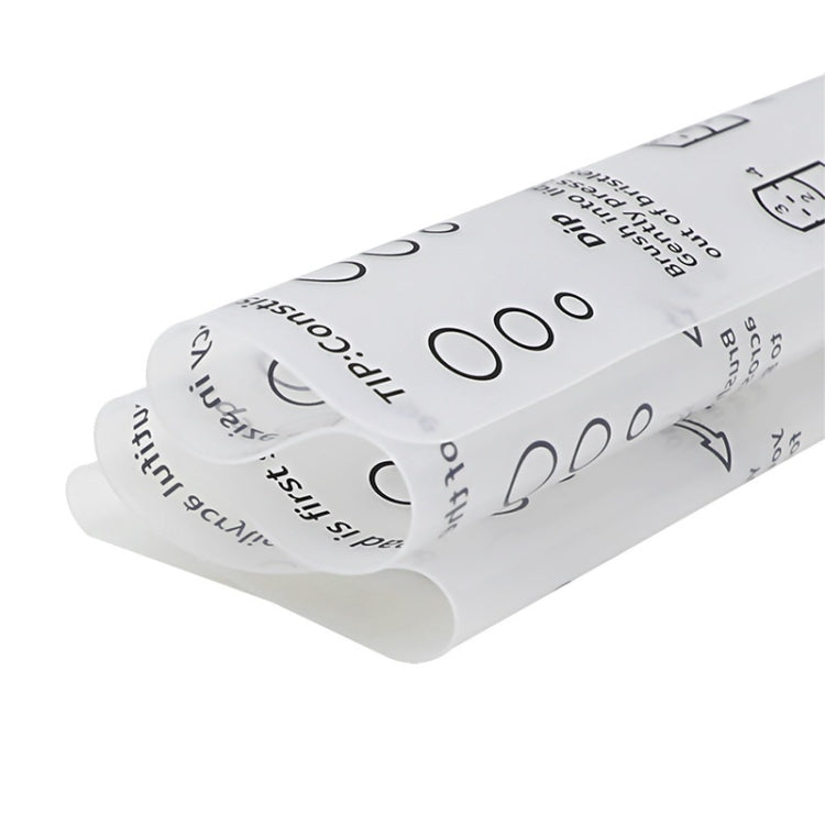 White silicone manicure pad palette in rolled form, showing thickness and circular markings