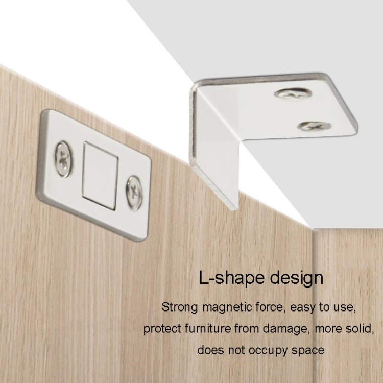Silver L-shaped magnetic suction cabinet door brackets on wood surface
