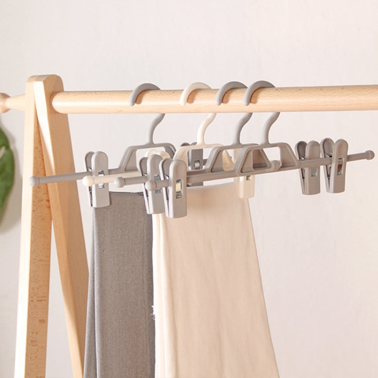 Set of rotatable pants hangers with non-slip clips on a bar