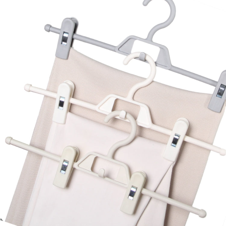 Cluster of rotatable pants hangers with anti-slip clips in white and gray