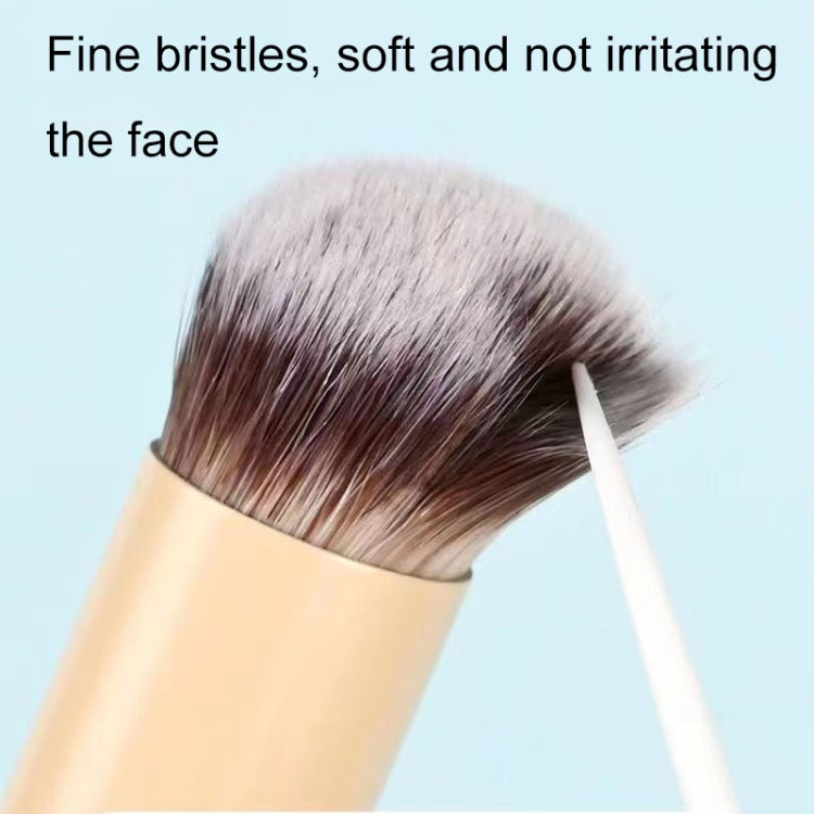 Soft bristle makeup brush head in a fan shape on a light handle