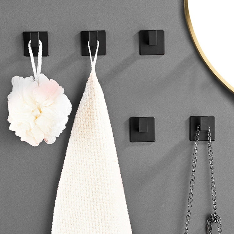 Set of black wall hooks with hanging loops for clothes, hats, or towels