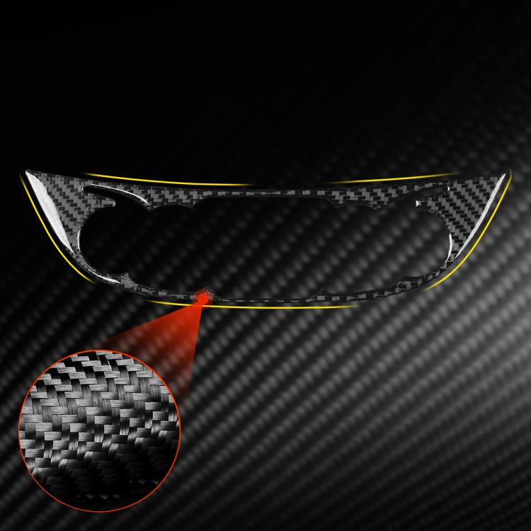 Black carbon-fiber central control knob panel sticker, close-up weave texture