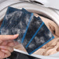 Washing machine hair remover pad, blue stripe and dark fuzzy sponge held near washer drum.