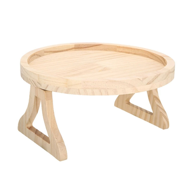 Round wooden folding tray with three tapered legs, light pine color.
