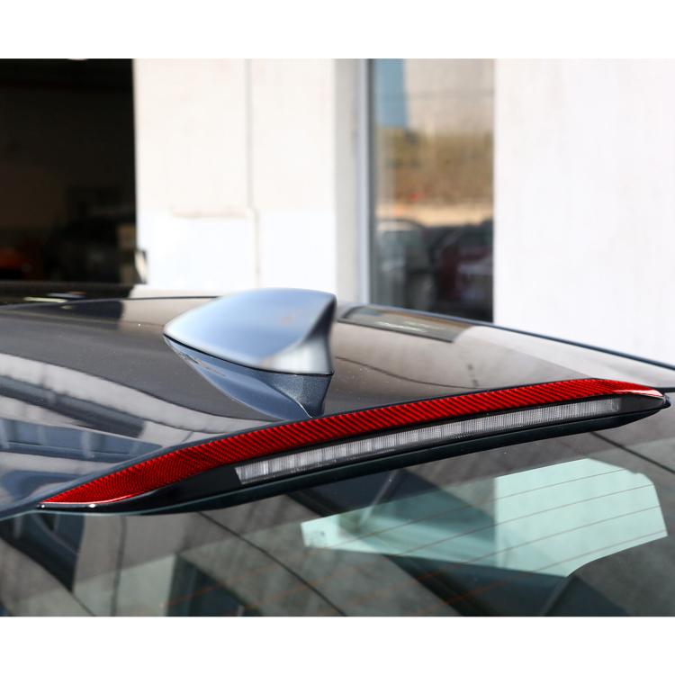 Red carbon-fiber headlight decorative trim strip installed on left corner