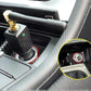 Car interior: cigarette lighter socket with plugged-in black device and green LED