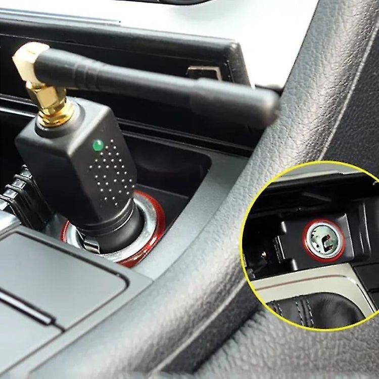 Car interior: cigarette lighter socket with plugged-in black device and green LED