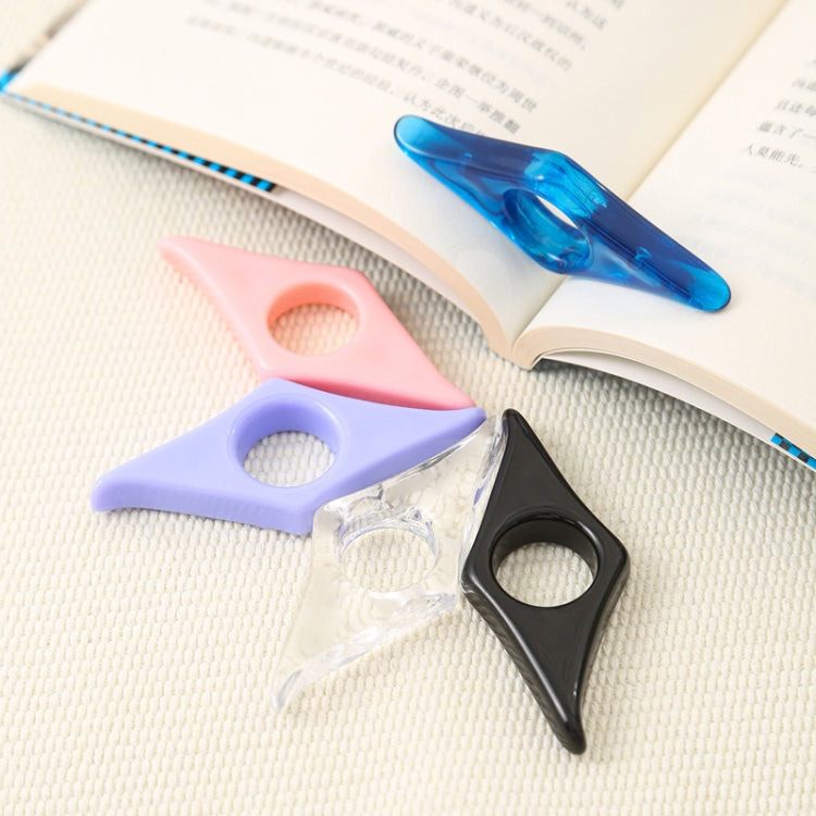 Set of acrylic thumb bookmarks in pink, purple, black, and blue on a book page.
