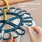 Blue round sock hanger with 20 clips, yellow hook, holding white socks