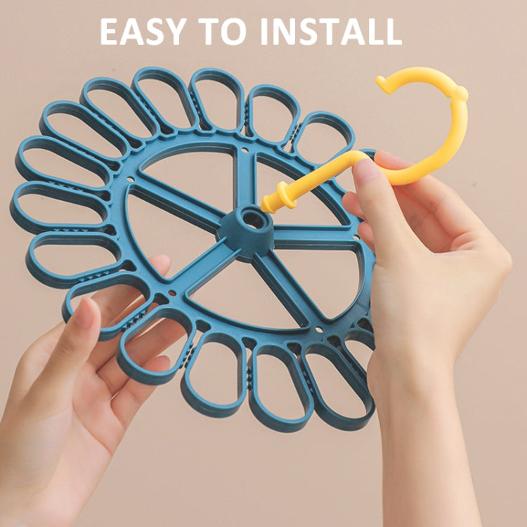 Round sock hanger base with 20 clips and yellow hook being attached