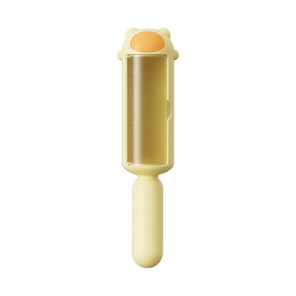 Yellow pet hair remover brush with clear roller chamber and grip handle