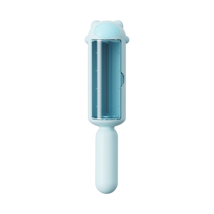 Blue pet hair remover brush with clear roller chamber and grip handle