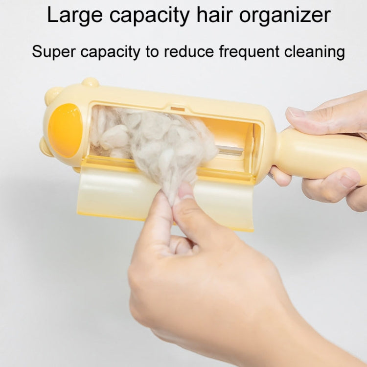 Yellow pet hair remover brush with hands opening the container