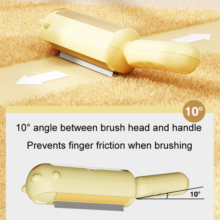 Cream pet hair remover brush angled over fabric