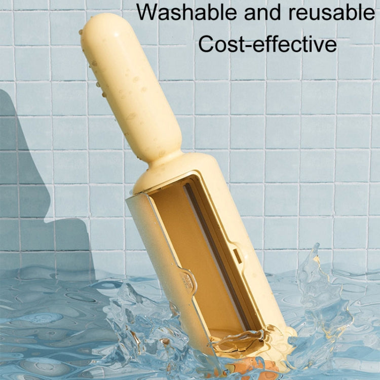 Yellow electrostatic pet hair remover brush with roller head, shown in water