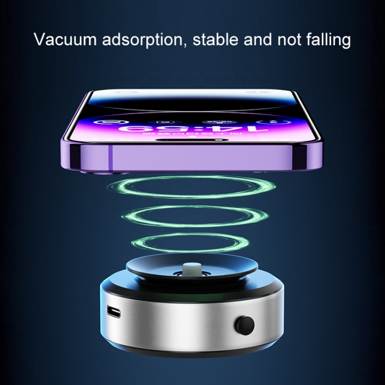 Silver and black magnetic phone holder with suction cup base and blue ring pad.
