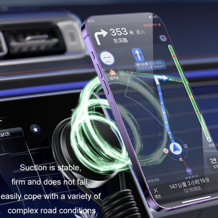 Magnetic phone mount with suction cup base; phone attached for car navigation.
