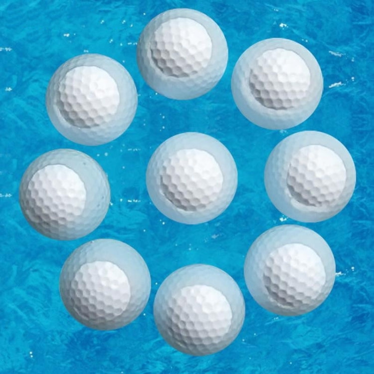 Set of floating white golf practice balls underwater, dimpled texture