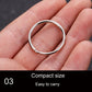 Small polished metal key holder ring held in hand