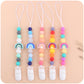 Set of five baby pacifier chain clips with rainbow beads and white silicone holders