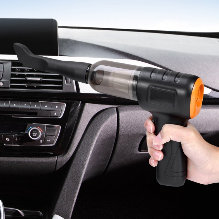 Handheld car vacuum cleaner being used, black nozzle held near car dashboard