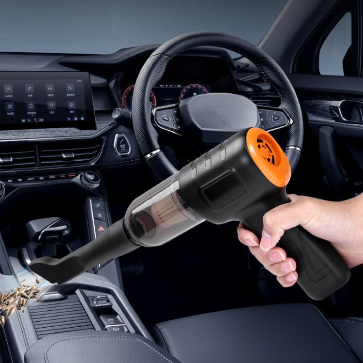Handheld cordless car vacuum cleaner in use, black body with orange trigger in car cabin
