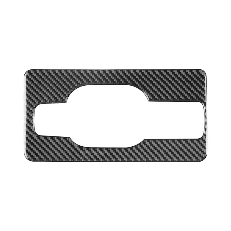 Black carbon-fiber trunk handle sticker with rectangular frame and oval cutout
