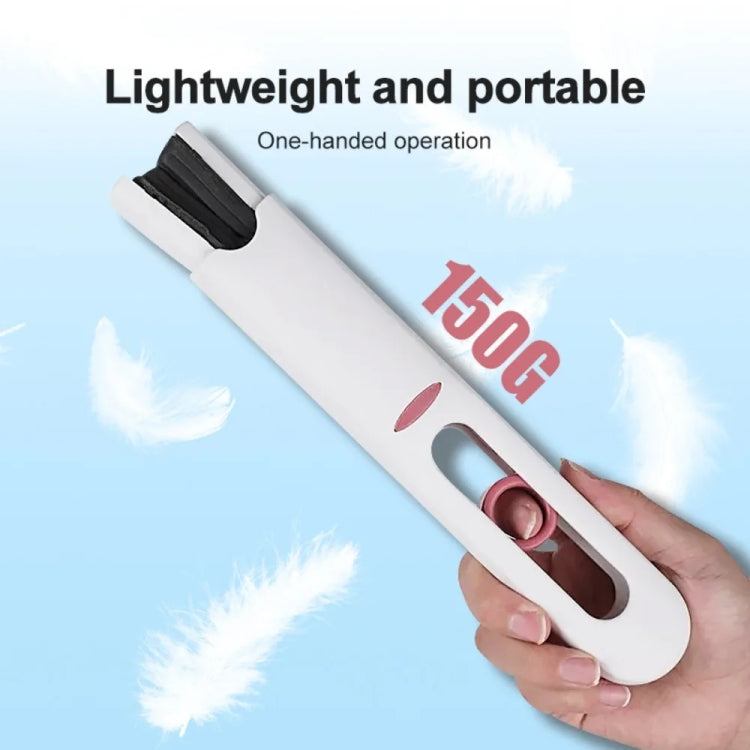 Portable white mini mop with gray bristle pad, held in hand for quick cleaning