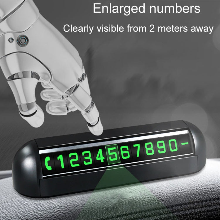 Black parking number display with glowing green digit window on windshield