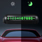 Black parking number display with green digits under night and day icons