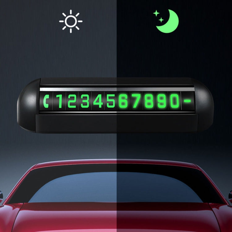 Black parking number display with green digits under night and day icons