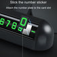 Black number display card slot with a green digit sticker being attached