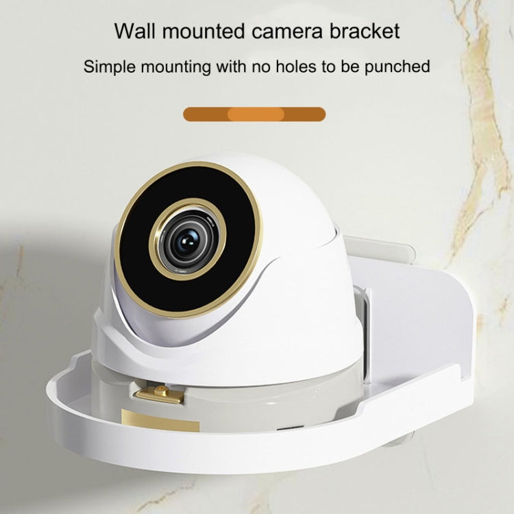 Transparent wall-mounted camera bracket with raised rim and security camera mounted on top