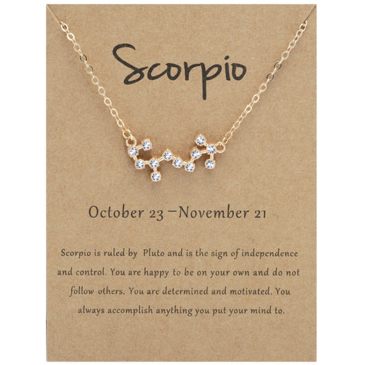 Gold-tone zodiac rhinestone necklace with Scorpio charm pendant on chain.